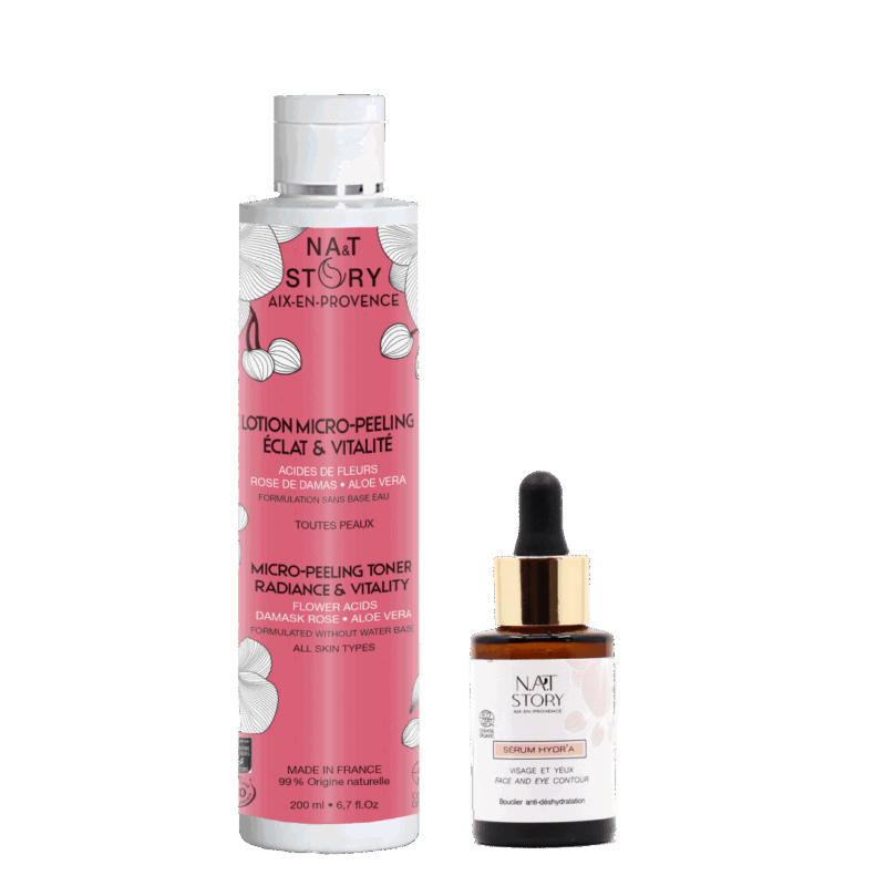 flacons de sérum et de lotion côte à côte sur fond blanc