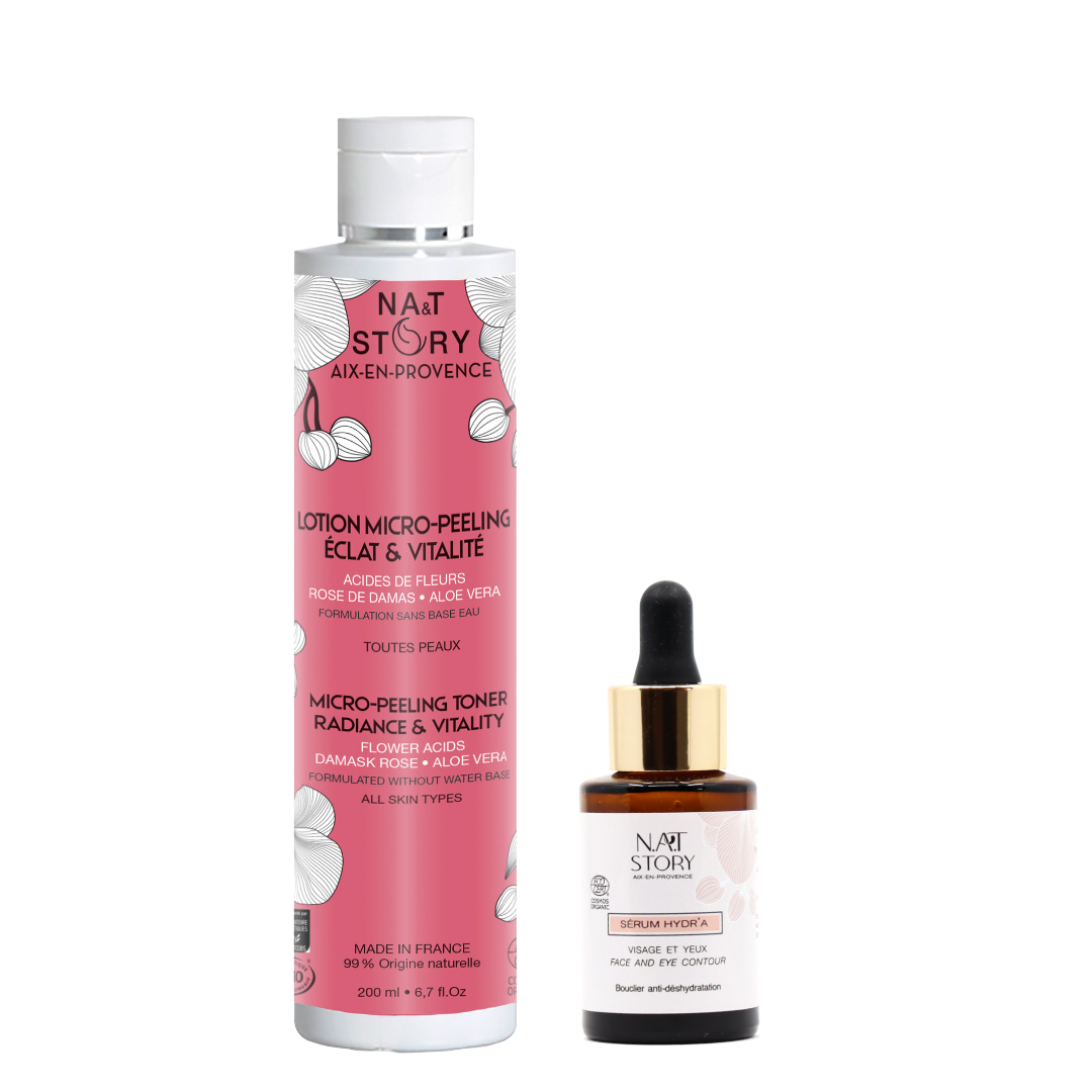 flacons de sérum et de lotion côte à côte sur fond blanc